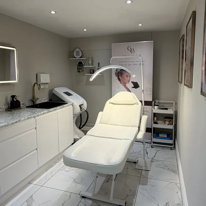 The Haus of CLB treatment room, with marble flooring and clinical lighting